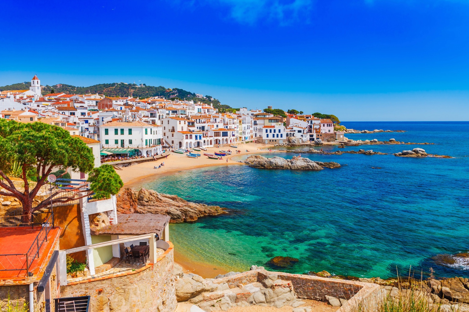 Whitewashed seaside village and clear Mediterranean water on the Costa Brava